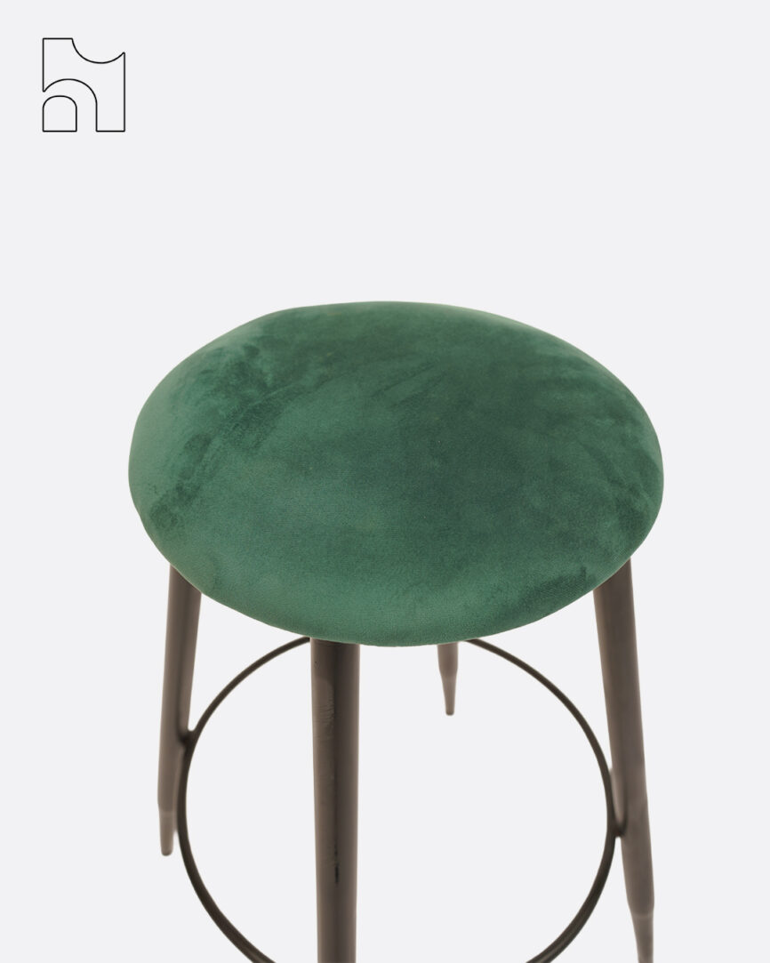 Shop the VelvetLoft Bar Stool with green velvet seat and black metal legs. Perfect for kitchen counters, home bars, and cafés seeking stylish, compact seating.